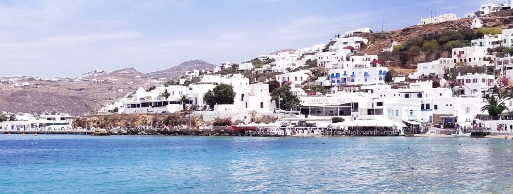 View of the white houses on the cliff from Mykonos Town
